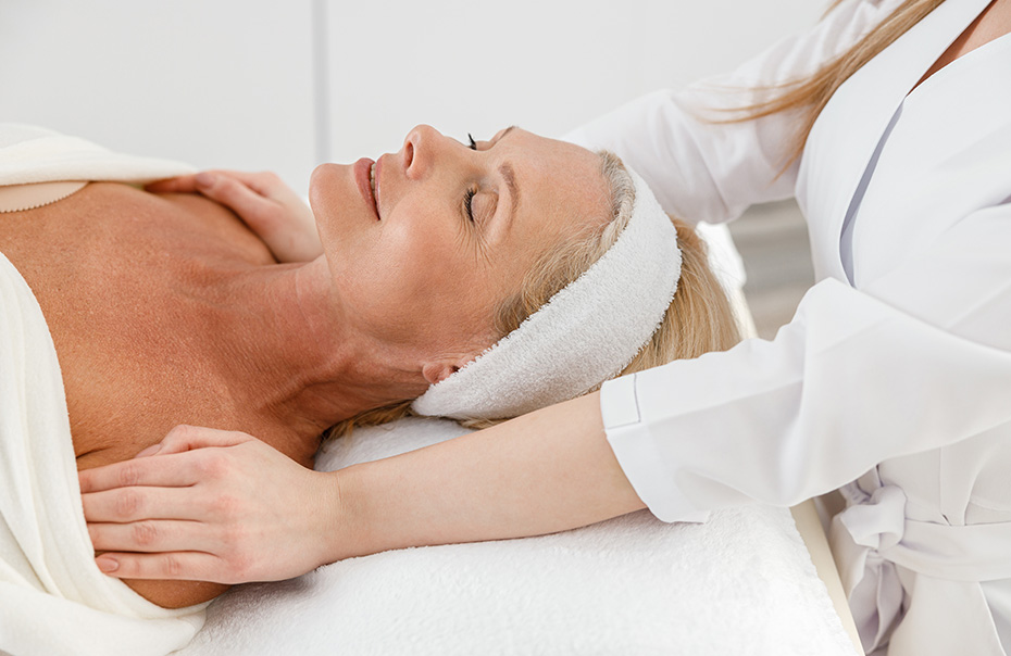 Older woman receiving gentle massage therapy as part of osteoporosis care in Pitt Meadows